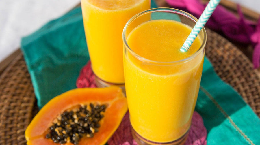 Mango Turmeric Smoothie with mango on side