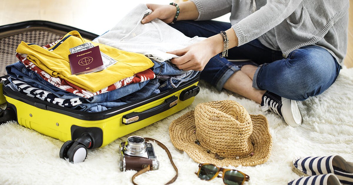 Woman packing suitcase