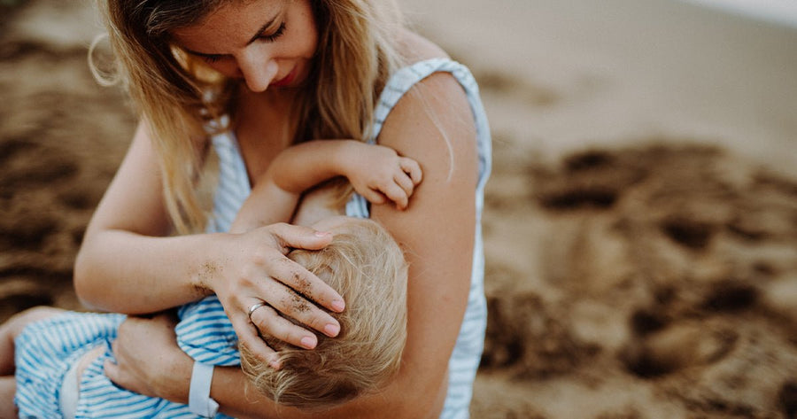 Mom learning how to increase milk supply