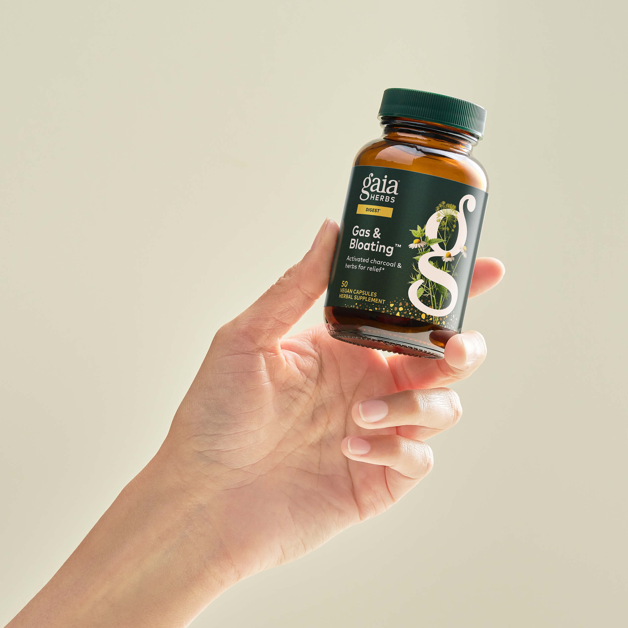 Gas & Bloating 50 count Bottle Held In A Person's Hand