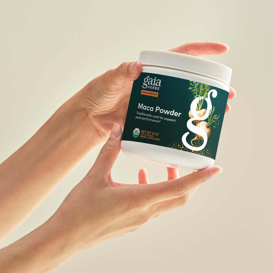 Maca Powder 8 ounce Bottle Held In A Person&#39;s Hand