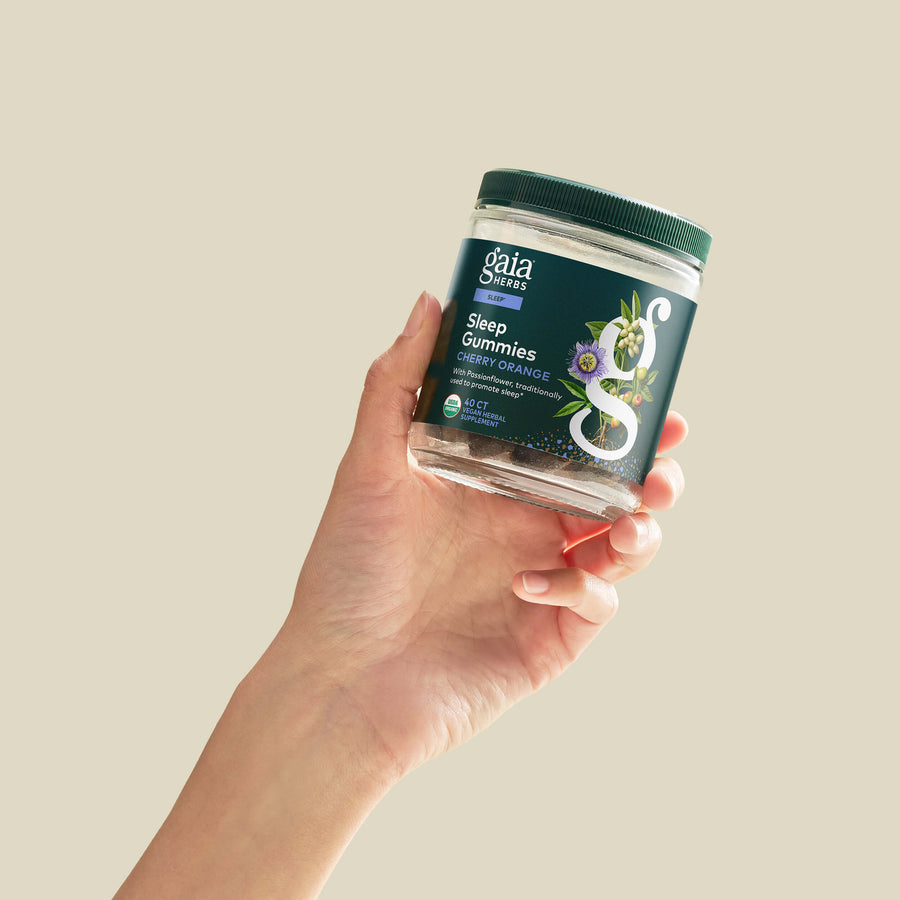 Sleep Gummies 40 count Bottle Held In A Person&#39;s Hand