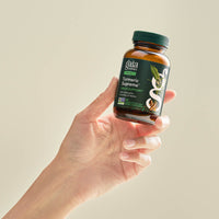 Turmeric Supreme Sinus Support 60 count Bottle Held In A Person&#39;s Hand