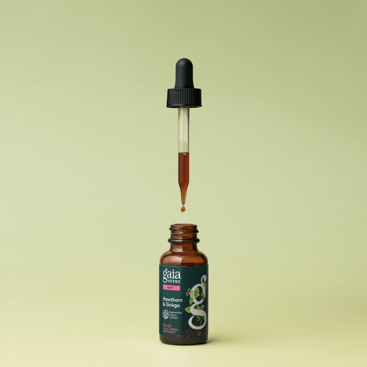 Gaia Herbs Hawthorn & Ginkgo tincture with dropper on a light green background